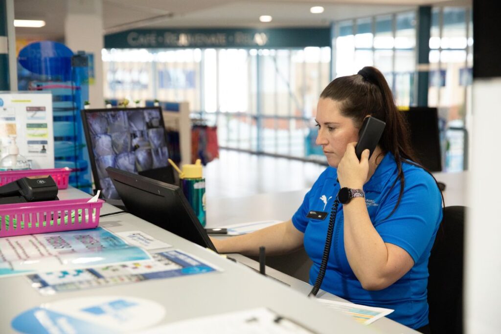 Receptionist taking a call at her desk