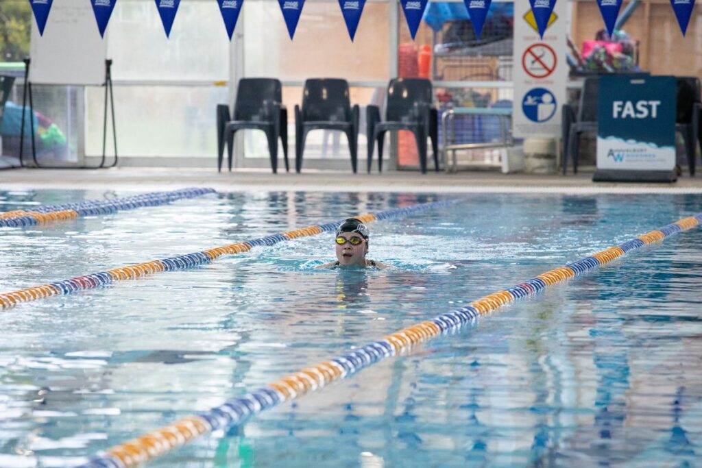 A swimmer in an indoor swimming pool